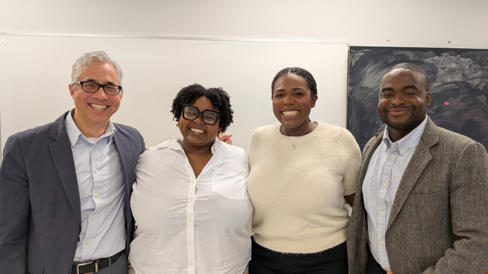 2 male Brown University staff and 2 female medical students, all of diverse backgrounds, pose together