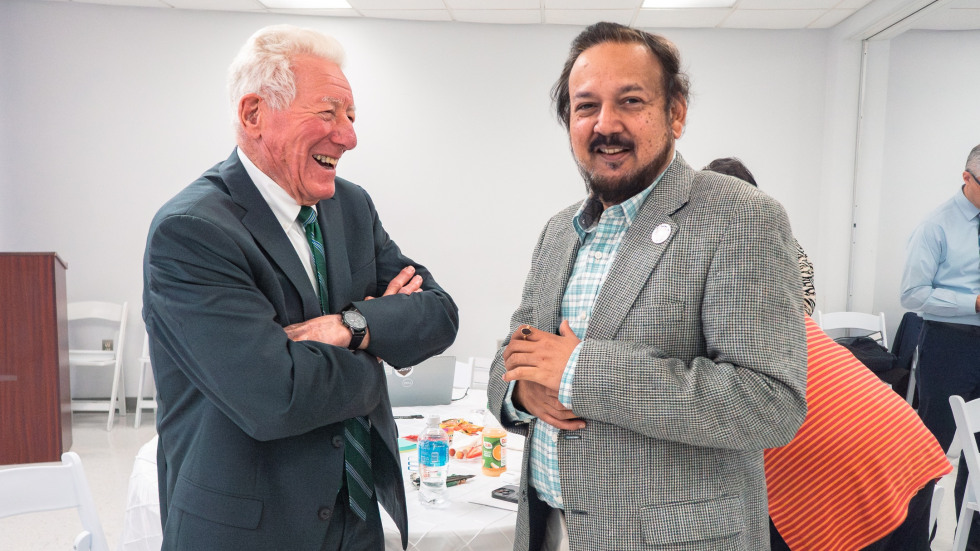 Two men engage in discussion