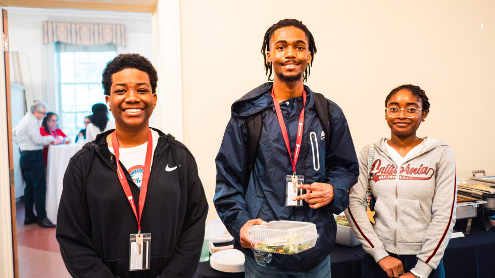 Three high school students pose for a photo